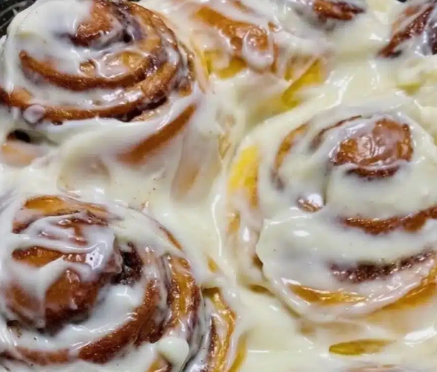 Why do you pour milk over cinnamon rolls before baking?